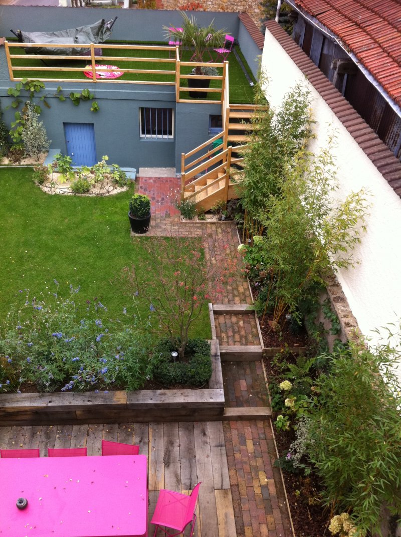 Rénovation du jardin et terrasse au dessus du garage et plantation des arbustes 
